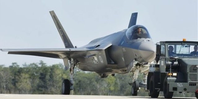 An Air Force Joint Strike Fighter is towed back to its hangar at Eglin Air Force Base, Fla.