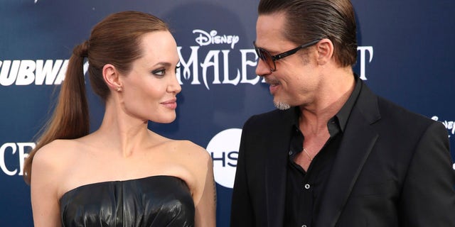 Angelina Jolie and Brad Pitt arrive at the world premiere of 