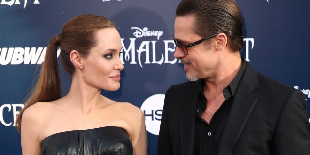 Angelina Jolie and Brad Pitt arrive at the world premiere of "Maleficent" in Los Angeles in 2014. Their divorce was finalized in 2019.