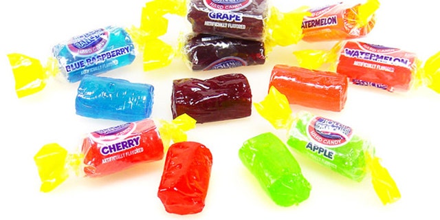 A couple flying with infant twins handed out bags of candy, which included Jolly Ranchers, to fellow passengers.