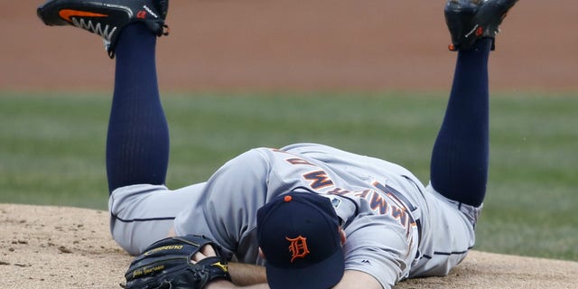 Detroit Tigers pitcher Jordan Zimmermann awaits medical attention after he was struck in the jaw by a line drive in a game against the Cleveland Indians, April 11, 2018.
