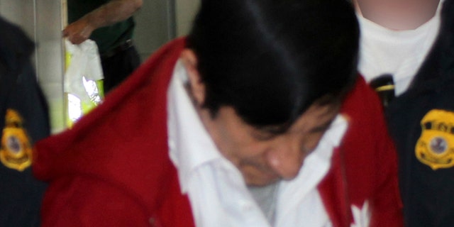 Jorge Sosa, a former Guatemalan soldier, as he is extradited to Los Angeles from Canada on Sept. 21, 2012.
