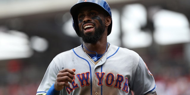 New York Mets third baseman Jose Reyes (7) smiles after scoring a run against the Washington Nationals in the first inning at Nationals Park on April 30, 2017.