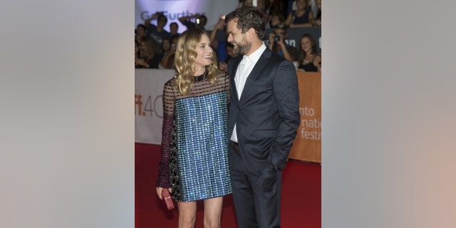Diane Kruger arrives with her boyfriend Joshua Jackson on the red carpet for the film "Disorder" during the 40th Toronto International Film Festival in Toronto, Canada, September 17, 2015. TIFF runs from September 10-20. REUTERS/Mark Blinch - RTS1NK6