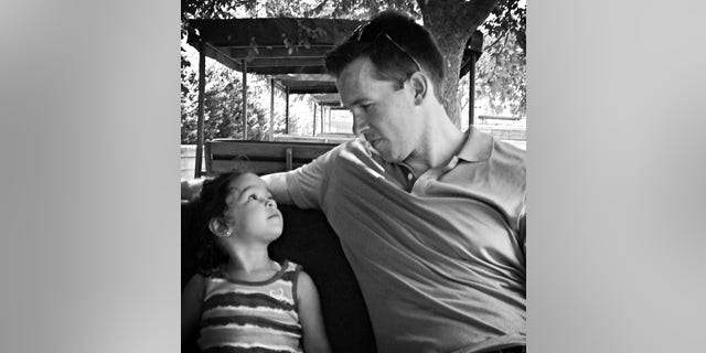 Joshua Rogers and his daughter.