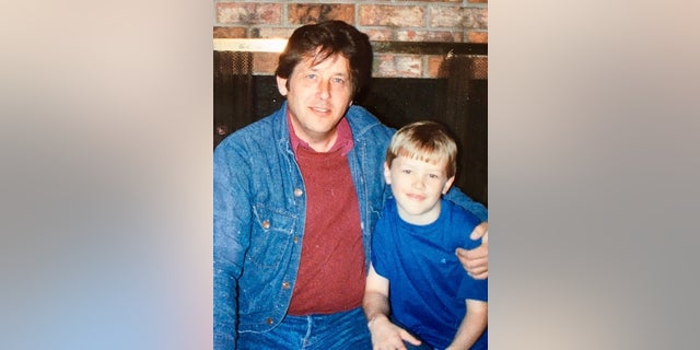 Rogers photographed with his father.