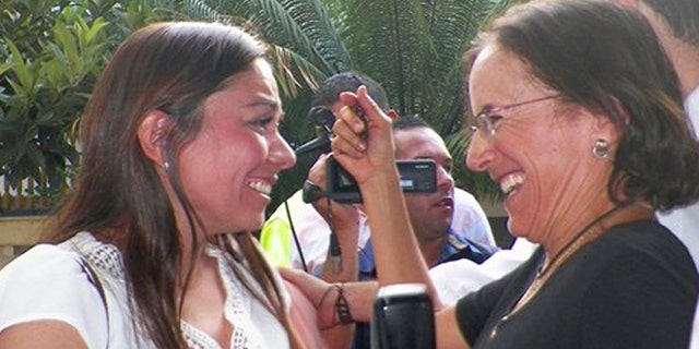 Salud Hernandez-Mora, right, correspondent in Colombia for Spain's El Mundo and columnist for the Bogota daily El Tiempo, is greeted by Melisa Gomez after Salud was freed by rebels of the National Liberation Army (ELN) in Ocana, northeastern Colombia, Friday, May 27, 2016. Gomez is the wife of Jose Cabrales Camacho, a man who was held captive by the ELN for seven months. Hernandez-Mora said she was taken captive on May 21 while working on a story about coca growers in a mountainous area dominated by rebels and drug-traffickers near the border with Venezuela. (AP Photo)