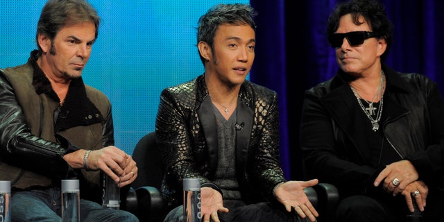 Jonathan Cain, left, Arnel Pineda, center, and Neal Schon of the rock band Journey take part in a panel discussion on the Independent Lens documentary "Don't Stop Believin': Everyman's Journey," at the PBS Summer 2013 TCA press tour at the Beverly Hilton Hotel on Tuesday, Aug. 6, 2013, in Beverly Hills, Calif. (Photo by Chris Pizzello/Invision/AP)