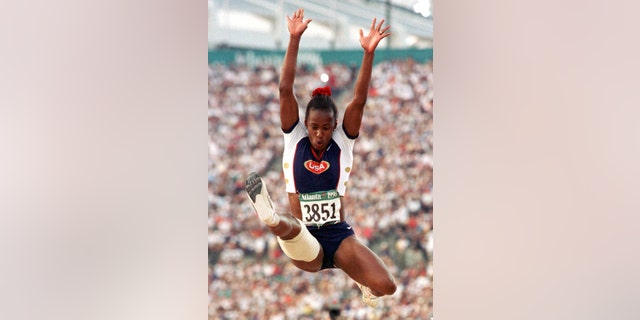 Jackie Joyner-Kersee of the United States competes in the finals of the women's long jump competition Aug. 2, 1996 at the Olympic stadium in Atlanta (Reuters).