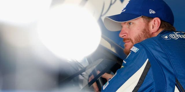 HOMESTEAD, FL - NOVEMBER 20: Dale Earnhardt Jr., driver of the #88 Nationwide Chevrolet, stands in the garage area during practice for the NASCAR Sprint Cup Series Ford EcoBoost 400 at Homestead-Miami Speedway on November 20, 2015 in Homestead, Florida. (Photo by Brian Lawdermilk/Getty Images)
