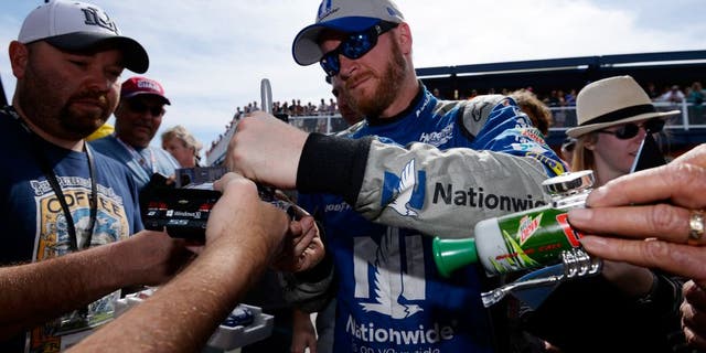 LAS VEGAS, NV - MARCH 04: Dale Earnhardt Jr, driver of the #88 Nationwide Chevrolet, signs autographs for fans during practice for the NASCAR Sprint Cup Series Kobalt 400 at Las Vegas Motor Speedway on March 4, 2016 in Las Vegas, Nevada. (Photo by Robert Laberge/Getty Images)