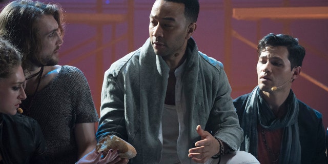 JESUS CHRIST SUPERSTAR LIVE IN CONCERT -- "Promo Shoot" -- Season: 2018 -- Pictured: (l-r) Ensemble, John Legend as Jesus Christ, Jason Tam as Peter -- (Photo by: Virginia Sherwood/NBC)