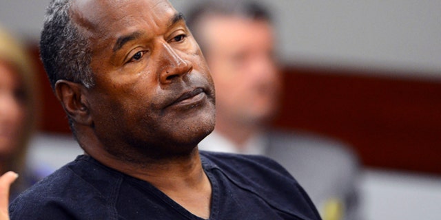 O.J. Simpson watches his former defense attorney Yale Galanter testify during an evidentiary hearing in Clark County District Court in Las Vegas, Nevada May 17, 2013.