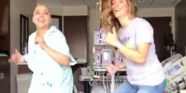 Ana-Alecia Ayala, left, and her dance partner have gone viral for their 'Juju on That Chemo' dance.