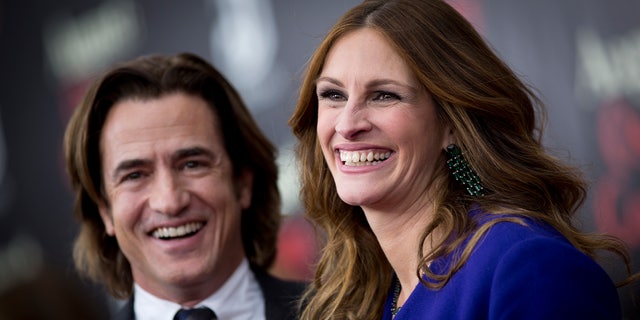 December 12, 2013. Cast members Dermot Mulroney and Julia Roberts arrive for the premiere of the movie  "August: Osage County" in New York.