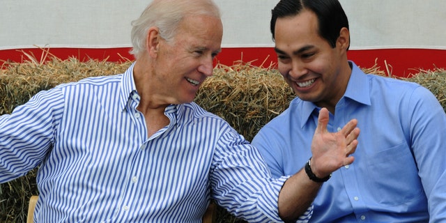 U.S. Vice President Joe Biden and San Antonio Mayor Julian Castro share a moment onstage at the 36th Annual Harkin Steak Fry on September 15, 2013 in Indianola, Iowa.