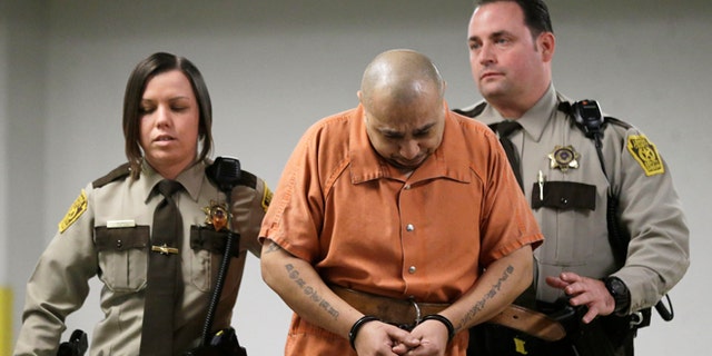 March 7, 2013: Julio Acevedo is escorted to a hearing at the Lehigh County Courthouse in Allentown, Pa. Acevedo was arrested in Pennsylvania on Wednesday after a friend arranged his surrender and was ordered held without bail. He is a suspect in a hit-and-run crash that killed a pregnant woman and her husband on their way to a hospital in New York. Their premature baby, delivered after the crash, later died.