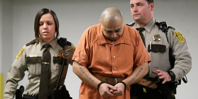 March 7, 2013: Julio Acevedo is escorted to a hearing at the Lehigh County Courthouse in Allentown, Pa. Acevedo was arrested in Pennsylvania on Wednesday after a friend arranged his surrender and was ordered held without bail. He is a suspect in a hit-and-run crash that killed a pregnant woman and her husband on their way to a hospital in New York. Their premature baby, delivered after the crash, later died.