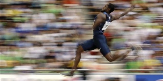 USA's Dwight Phillips competes in a Men's Long Jump qualification round at the World Athletics Championships in Daegu, South Korea, Thursday, Sept. 1, 2011. (AP Photo/David J. Phillip)