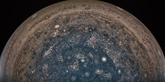 NASA’s Juno spacecraft soared directly over Jupiter’s south pole when JunoCam acquired this image on Feb. 2, 2017, from an altitude of about 62,800 miles (101,000 kilometers) above the cloud tops. This image was processed by citizen scientist John Landino. This enhanced color version highlights the bright high clouds and numerous meandering oval storms.