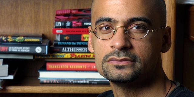 ** FILE ** Writer and Syracuse University professor Junot Diaz poses for a portrait in his Syracuse, N.Y., apartment Nov. 7, 2001. Diaz was awarded the Pulitzer for Fiction for "The Brief Wondrous Life of Oscar Wao." (AP Photo/Jim McKnight,File)