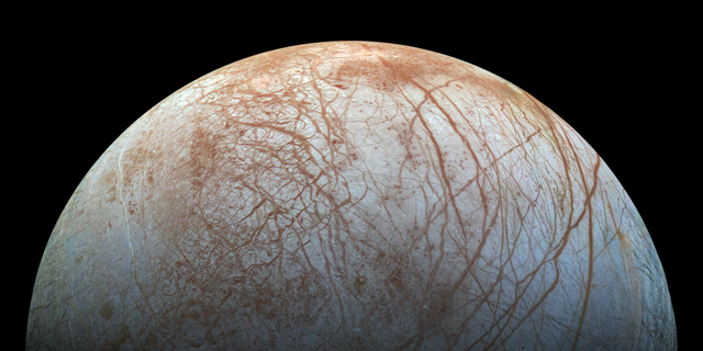 The frozen surface of Jupiter's icy moon Europa is seen in extreme detail in this remastered photo made from images taken by NASA's Galileo spacecraft in the late 1990s. A new study suggests that the ice on Europa may move between the moon's poles and its equator.