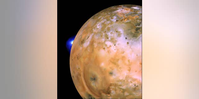 Voyager 1 image of Jupiter's volcanic moon Io showing the active plume of a volcano called Loki. Th heart-shaped feature southeast of Loki consists of fallout deposits from active plume Pele. The images that make up this mosaic were taken from an average distance of about 340,000 miles (490,000 kilometers).