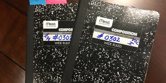 Duncan showed her two notebooks with juror number #0302 on the covers.