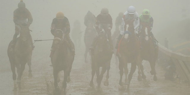 Horses ran in the fog and mud during the Preakness Stakes on Saturday.