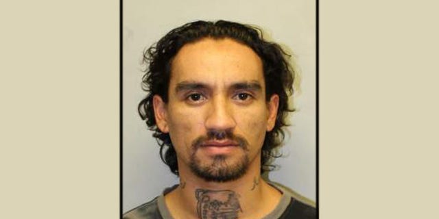 Authorities are searching for Justin Joshua Waiki, who is accused of killing a police officer during a traffic stop.