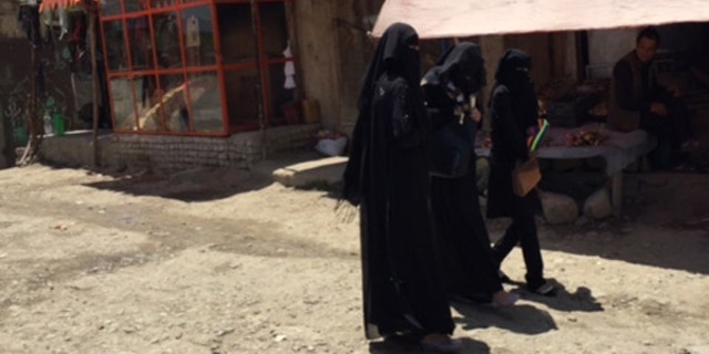 Women at an outdoor market in Kabul