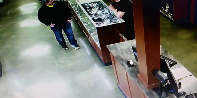 Feb. 20, 2016: In this photo provided by Southwick's gun store, Jason Dalton, left, appears in the store in Plainwell, Mich., hours before he went on a shooting rampage. (Southwick's Gun Store via AP)