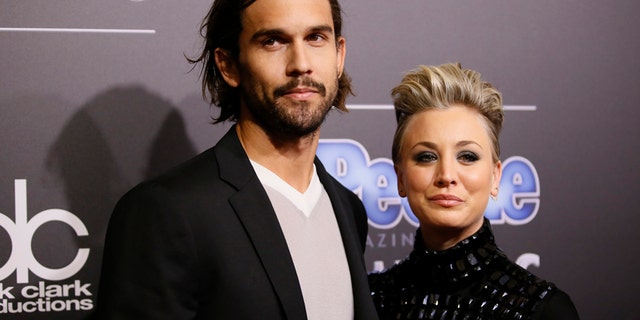 Actress Kaley Cuoco-Sweeting and husband Ryan Sweeting arrive at the People Magazine Awards in Beverly Hills, California December 18, 2014.