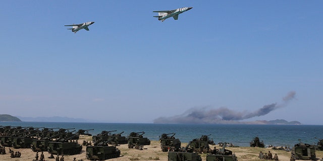 Aug. 26, 2017: Jets perform a flyby after a live fire "target-striking contest" held by North Korean leader Kim Jong Un just next to Kalma International Airport in Wonsan, North Korea. The country is trying to turn the beach region into a bustling tourist destination.