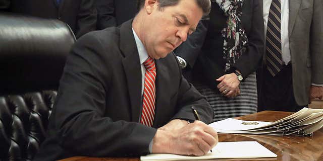 April 2, 2015: Gov. Sam Brownback signed bipartisan legislation.