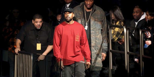 Kanye West (C) and Lamar Odom arrive at Kanye West's Yeezy Season 3 presentation and listening party for the new "The Life of Pablo" album during New York Fashion Week February 11, 2016.