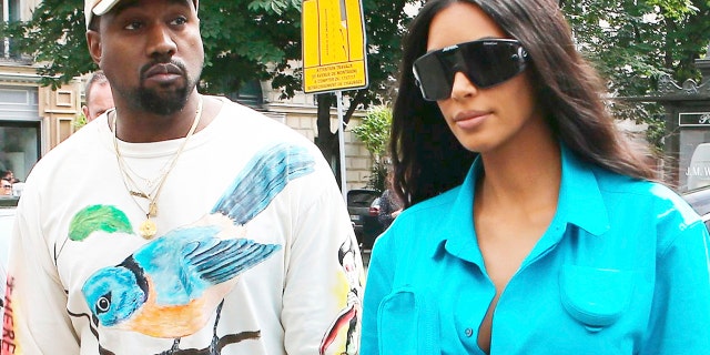 Kim Kardashian took her husband Kanye West to the ER after he reportedly came down with the flu, a new report says. The couple is pictured here in Paris.