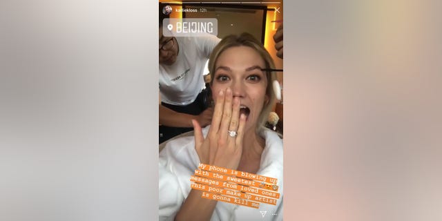 Karlie Kloss flaunts what appears to be an engagement ring given to her by fiance Josh Kushner.