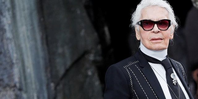 German designer Karl Lagerfeld appears at the end of his Spring/Summer 2018 women's ready-to-wear collection show for fashion house Chanel at the Grand Palais during Paris Fashion Week, France, October 3, 2017. REUTERS/Gonzalo Fuentes - RC18298D3B00