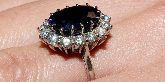 Kate Middleton shows her engagement ring given by Britain's Prince William in London November 16, 2010.