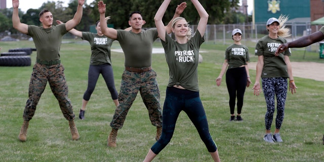 Model and actress Kate Upton takes part in a "workout with the Marines" to raise awareness for Marine Week, Tuesday, Aug. 22, 2017, in Detroit. Upton, fiancé of Detroit Tigers pitcher and Wins for Warriors founder Justin Verlander, and other Tigers Wives participated in a scaled-down workout led by Gunnery Sergeant Sara Pacheco to help support and promote the 2017 Wins for Warriors Patriot Ruck, taking place Saturday, Sept. 9 in Detroit. (AP Photo/Carlos Osorio)