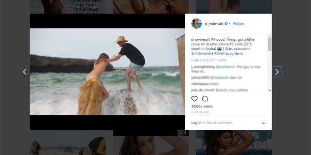 Kate Upton falls during a photo shoot in Aruba.