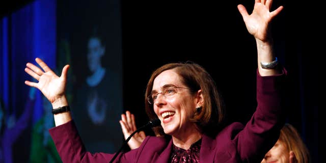 Nov. 6, 2012: Oregon Democratic Secretary of State Kate Brown celebrates at the podium after winning her race at Democratic headquarters.