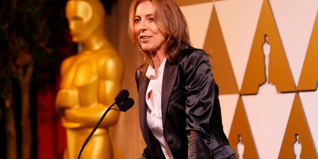 Director Kathryn Bigelow presents director Rithy Panh, whose Cambodian film "The Missing Picture" is nominated in the Foreign Language Film category, with a nomination certificate at the 86th Academy Awards Foreign Language Nominee Reception at Ray's and Stark Bar on the LACMA Campus in Los Angeles, February 28, 2014. REUTERS/Danny Moloshok (UNITED STATES - Tags: ENTERTAINMENT) - RTR3FUMG