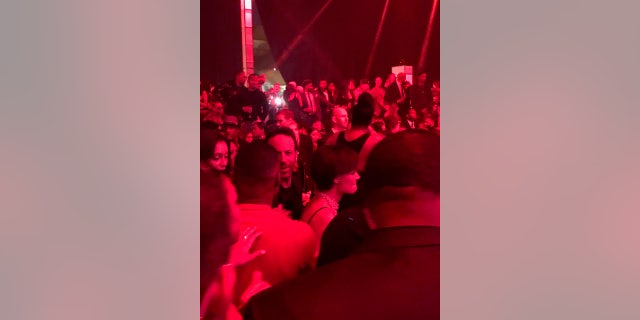 Katie Holmes spotted in the crowd at Jamie Foxx's 50th birthday bash.