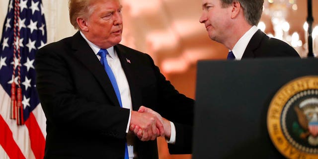 President Donald Trump shakes hands with Judge Brett Kavanaugh his Supreme Court nominee, in the East Room of the White House, Monday, July 9, 2018, in Washington. (AP Photo/Alex Brandon)