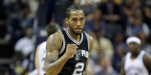MEMPHIS, TN - APRIL 22: Kawhi Leonard #2 of the San Antonio Spurs pumps his fist after making a three point shot against the Memphis Grizzlies in game four of the Western Conference Quarterfinals during the 2017 NBA Playoffs at FedExForum on April 22, 2017 in Memphis, Tennessee. NOTE TO USER: User expressly acknowledges and agrees that, by downloading and or using this photograph, User is consenting to the terms and conditions of the Getty Images License Agreement (Photo by Andy Lyons/Getty Images)