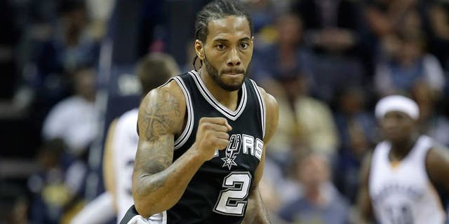 MEMPHIS, TN - APRIL 22: Kawhi Leonard #2 of the San Antonio Spurs pumps his fist after making a three point shot against the Memphis Grizzlies in game four of the Western Conference Quarterfinals during the 2017 NBA Playoffs at FedExForum on April 22, 2017 in Memphis, Tennessee. NOTE TO USER: User expressly acknowledges and agrees that, by downloading and or using this photograph, User is consenting to the terms and conditions of the Getty Images License Agreement (Photo by Andy Lyons/Getty Images)