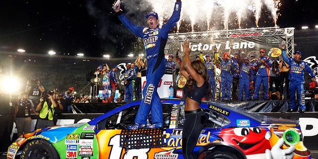 Kyle Busch celebrates in Victory Lane after winning the NASCAR Cup Series auto race, Saturday, Aug. 19, 2017, in Bristol, Tenn. (AP Photo/Wade Payne)