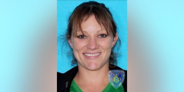 Authorities considered Kelly Folse a suspect in the dog's death because of hostile text messages she reportedly sent his owner, WDSU said.
